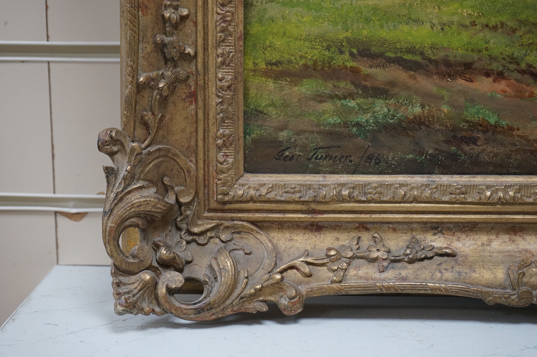 George Turner (1841-1910), oil on canvas, Riverscape with a horse and cart, signed and dated '86, 49 x 75cm, ornate gilt frame